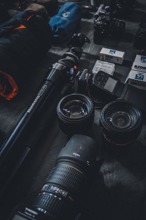 Tripods and camera gear on a table 