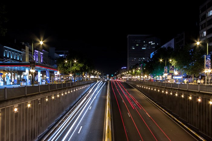 Streaming car light trails at Boulevard de Waterloo by night in Brussel Belgium for motion blur photography