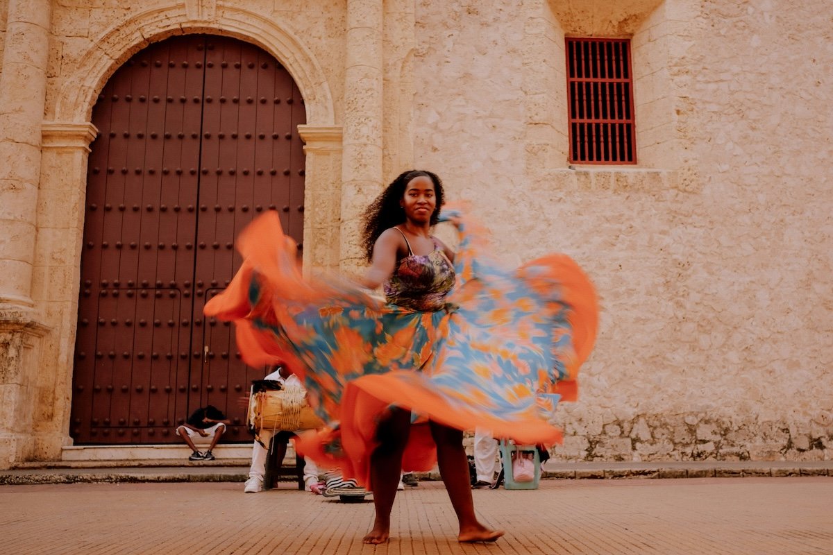 A woman dancing with her skirt showing motion blur