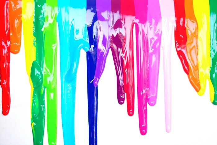 A rainbow of saturated colors dripping down iike paint