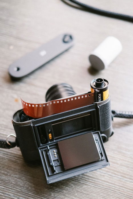 Close up of loading film into an old camera