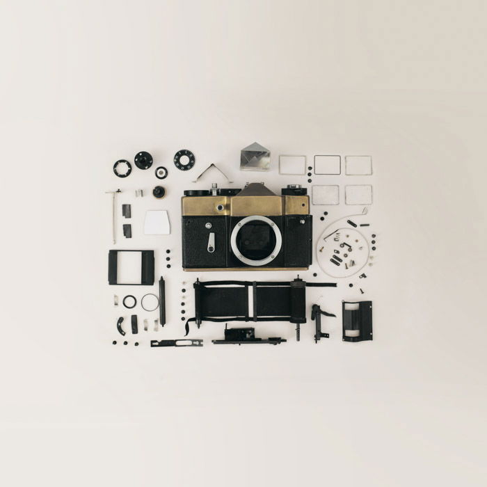 Flay lay photo of film camera and gear