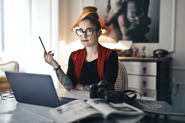 A photographer working on a laptop