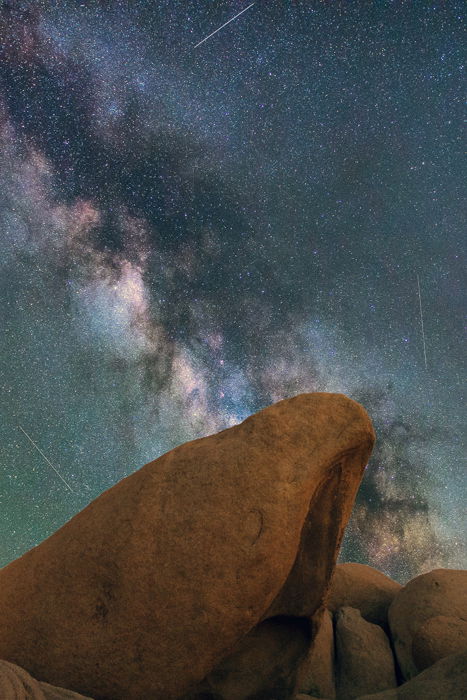 milky way above a rocky landscape