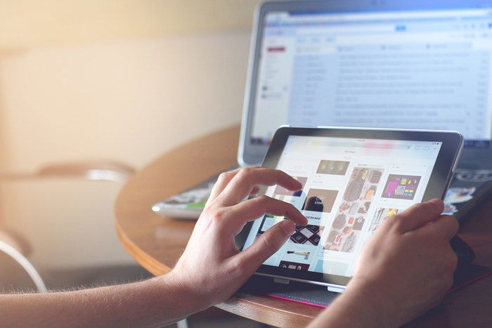 A person checking photos on a laptop