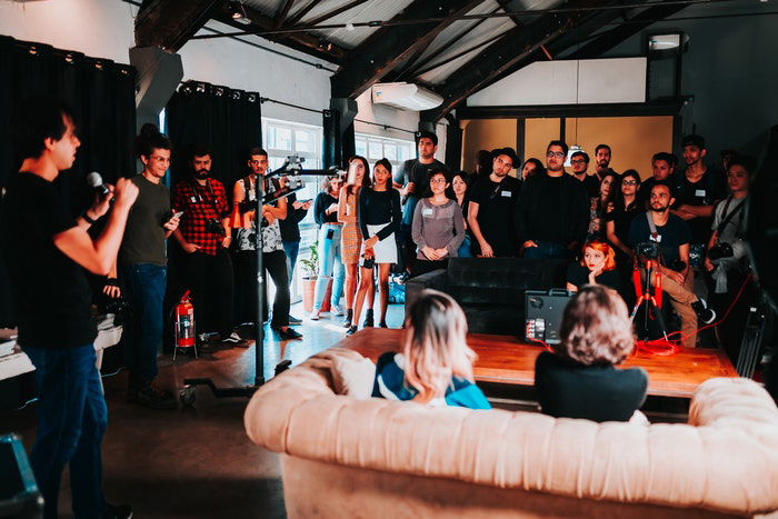 A crowd of people at an indoor event