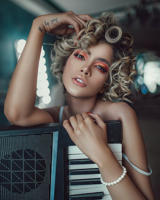 Portrait of a beautiful girl holding a keyboard