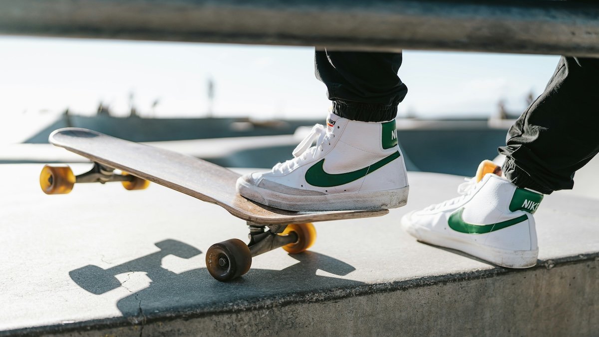 A close-up of a skateboarder's feet shoes and board as an example of close-up skateboard photography