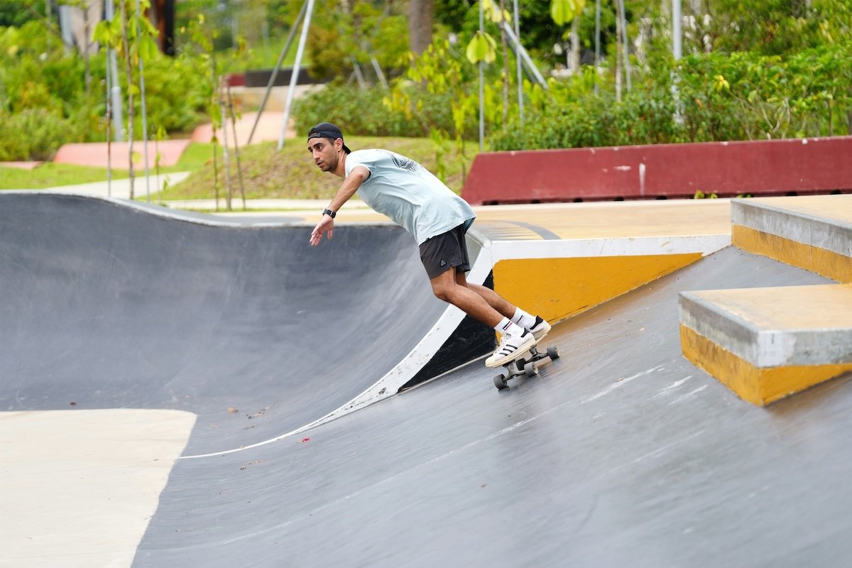 A skateboarder taking a ramp in a skatepark as an example for skateboard photography