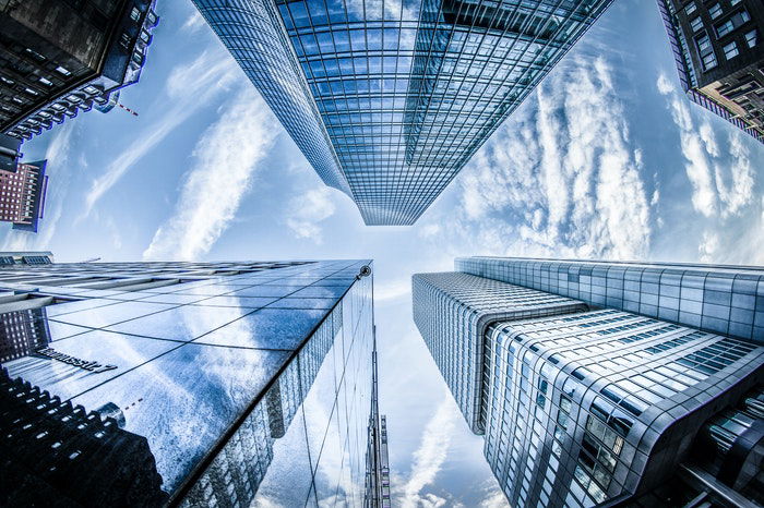 Low angle photo looking up at huge skyscrapers