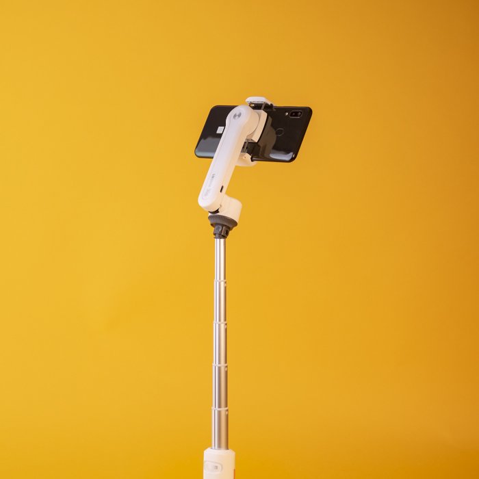 An iphone on a Zhiyun Smooth XS gimbal