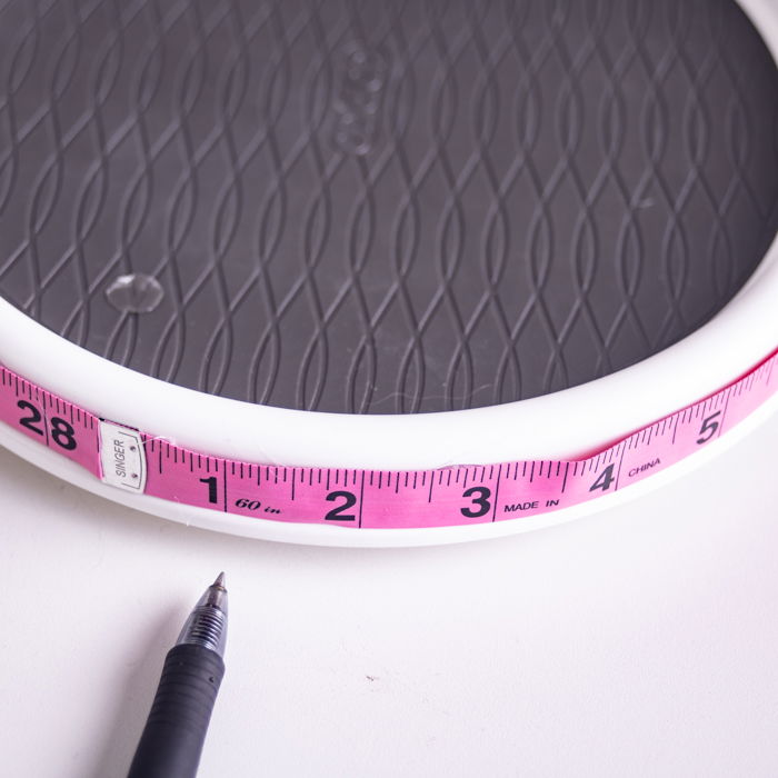 A man making a DIY Turntable for 360 product photos