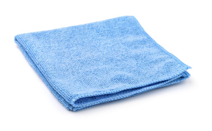 blue folded microfiber cloth against a white background