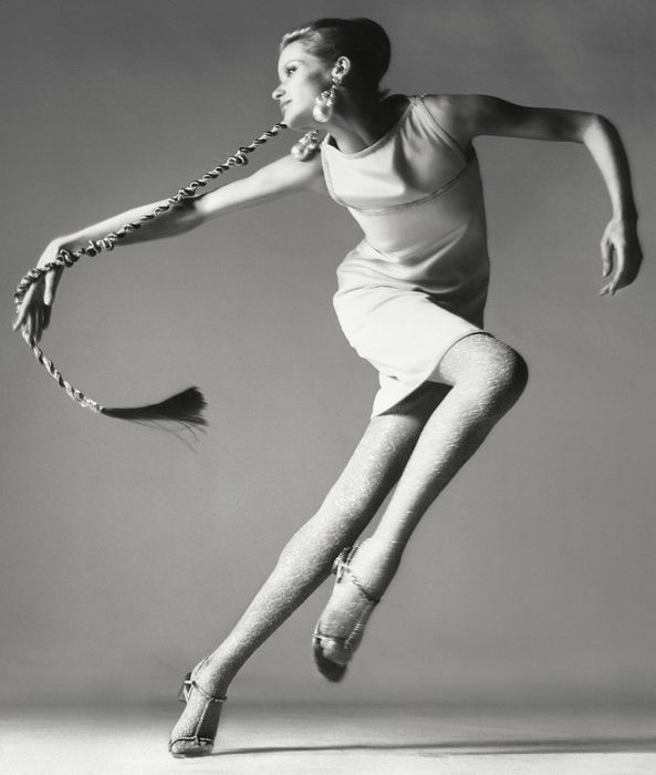 A woman in mid-ballet pose. 