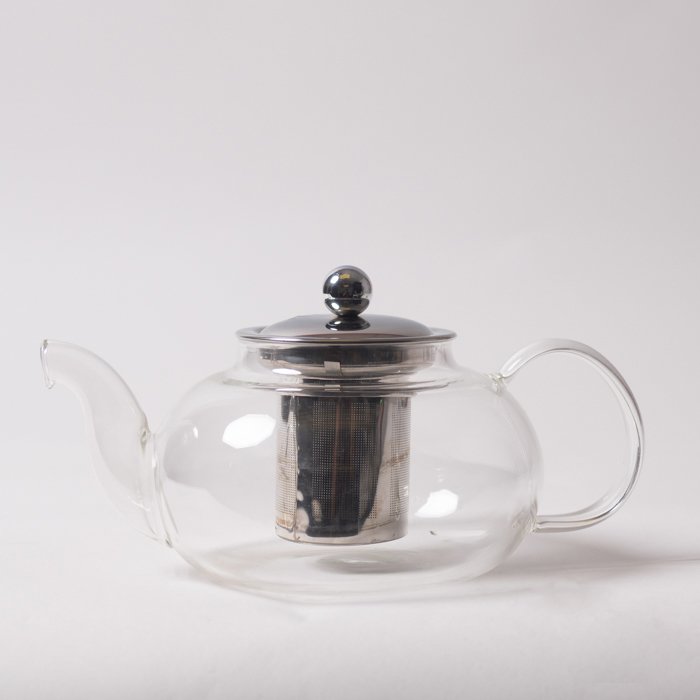 teapot made from glass and metal reflective surfaces