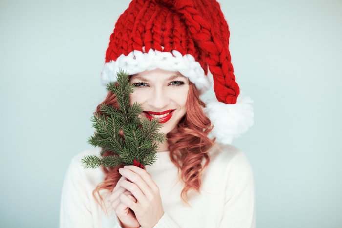 Christmas portrait of a woman in a Santa hat