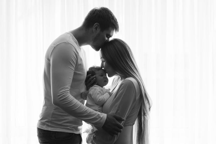 Millennial Family with Mom, Dad, and Beautiful Baby Girl Stock Photo - Alamy