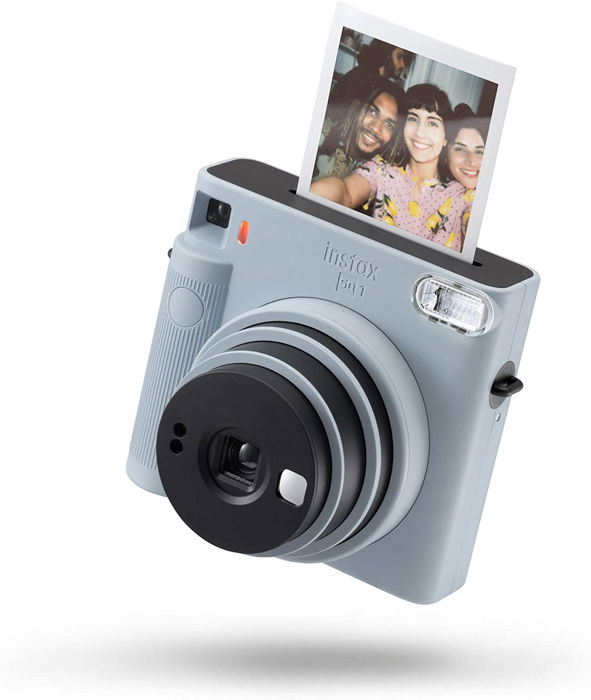 an image of a grey Instax mini 8 instant film camera with an instant photo coming out of the top