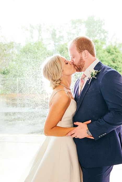 Outdoor wedding portrait of the happy couple