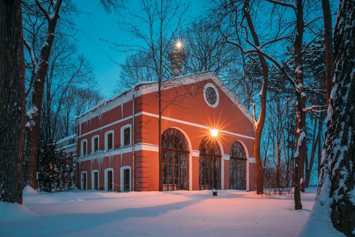 A building covered in snow on a winter evening