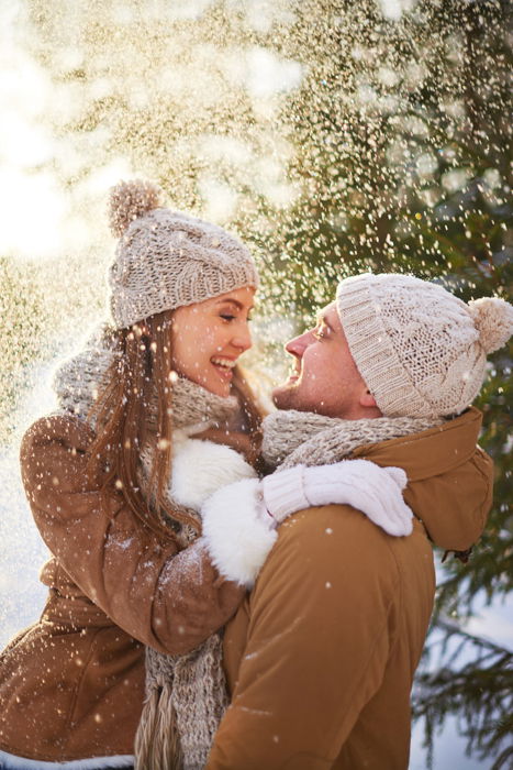 Premium Photo  Winter woman in snow looking at camera outside on snowing  cold winter day portrait caucasian female model outside in first snow