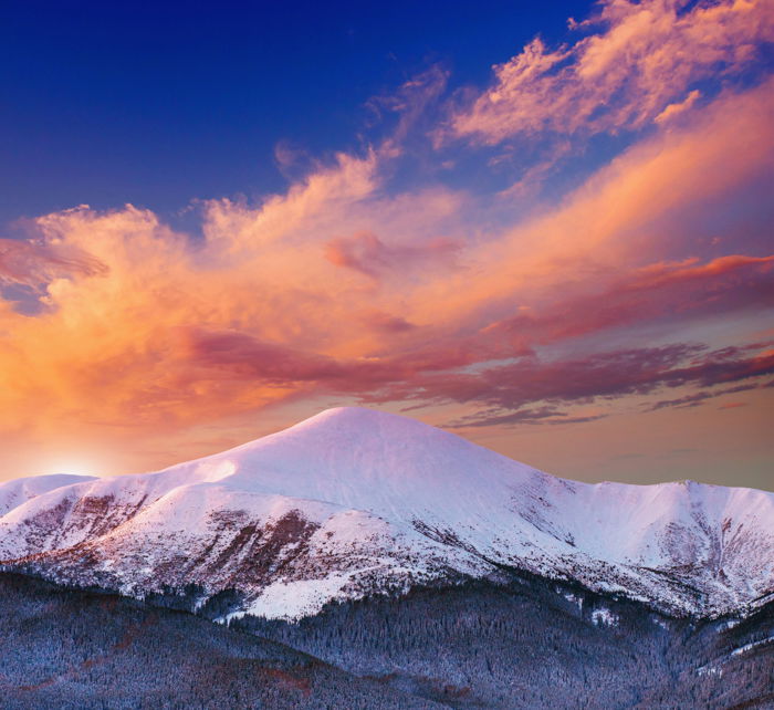 Evening clouds over a snowy winter landscape