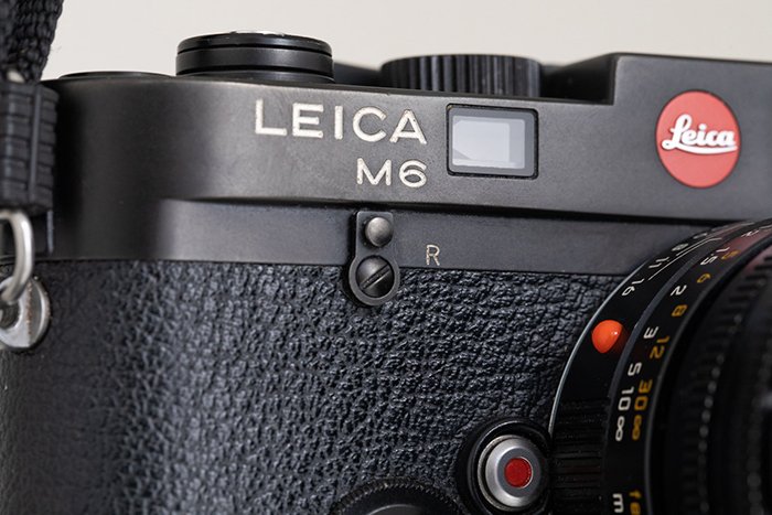 A photography of Leica M6 featuring the logo