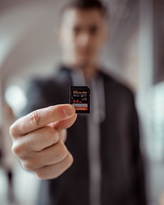A man holding a memory card