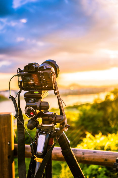 A DSLR camera on a tripod