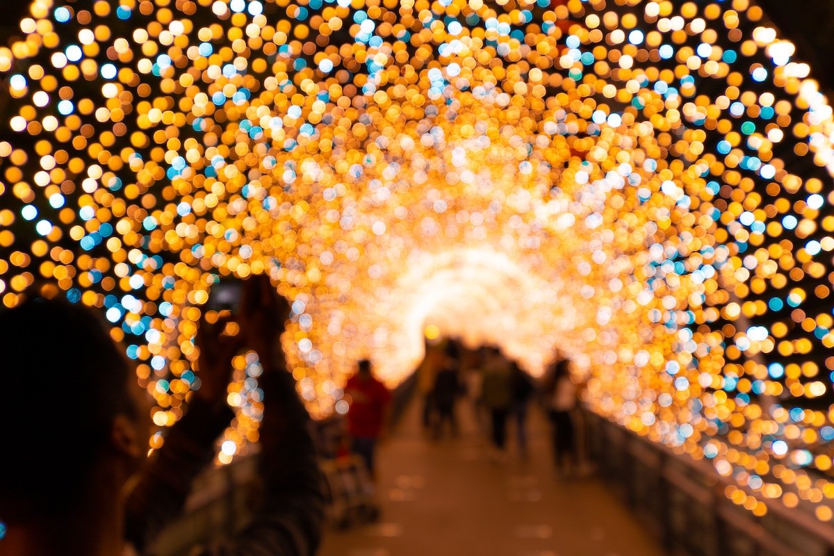 Colorful out-of-focus bokeh Christmas lights archway