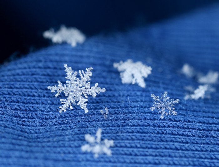 Macro closeup of snowflake crystals in bokeh.
