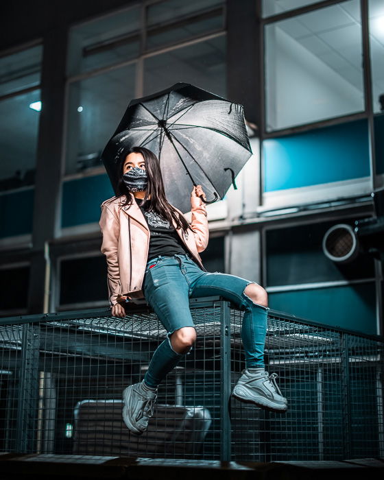 Image of a young female model with umbrellas shot with the RF 50mm f/1.2L USM lens