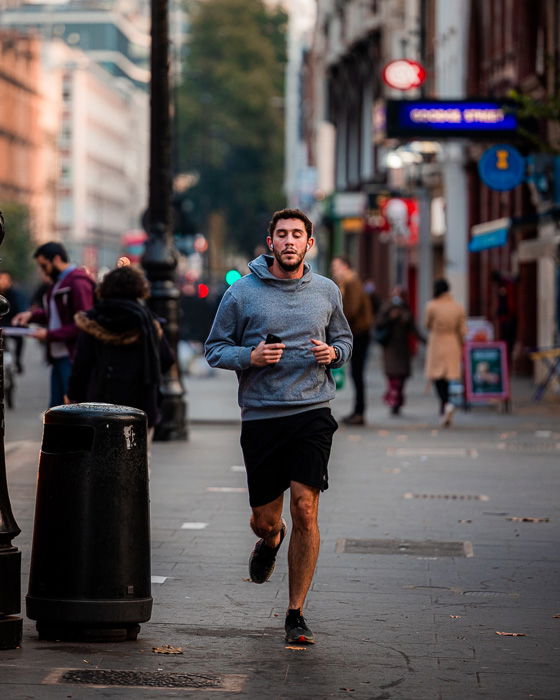 Street photography image of a runner taken with the Canon RF 70-200mm f/2.8L IS USM.