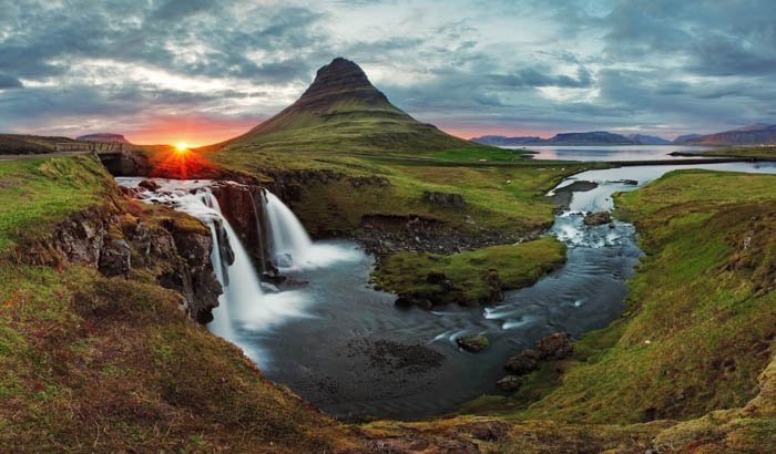Landscape panorama of kirkjufell spring in Iceland at sunset 