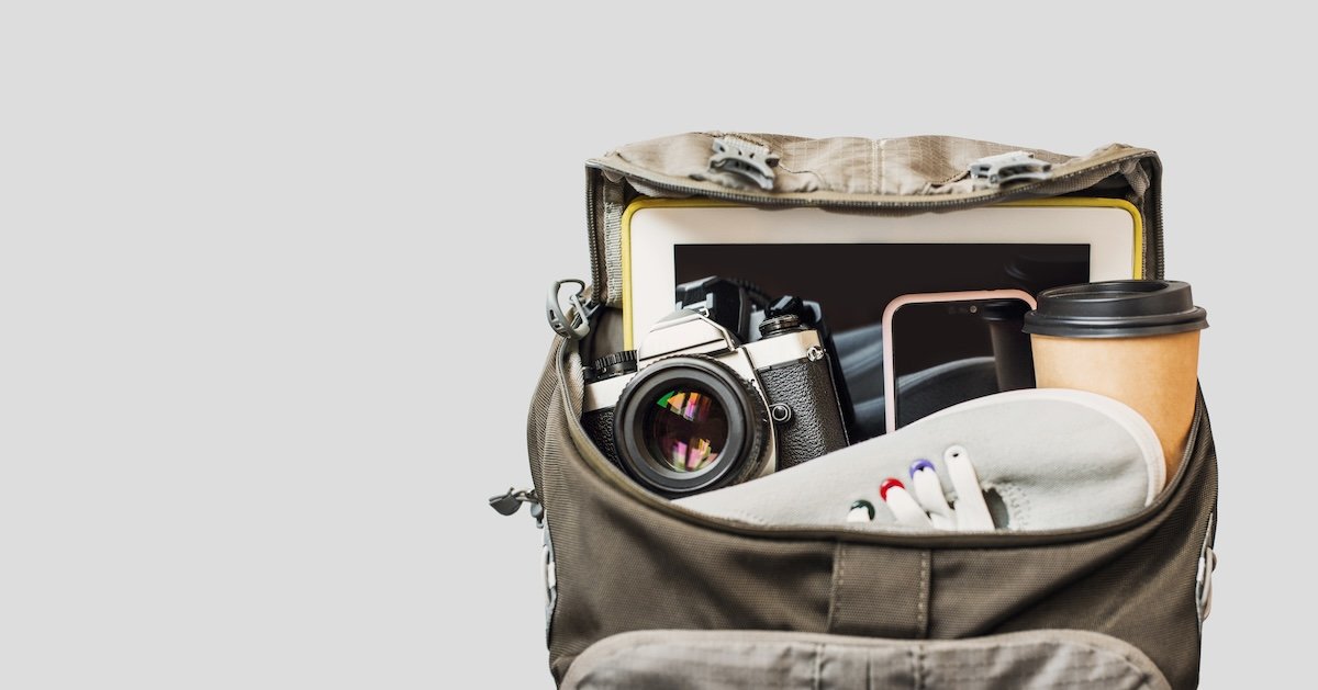 The top of a bag with a camera and other items