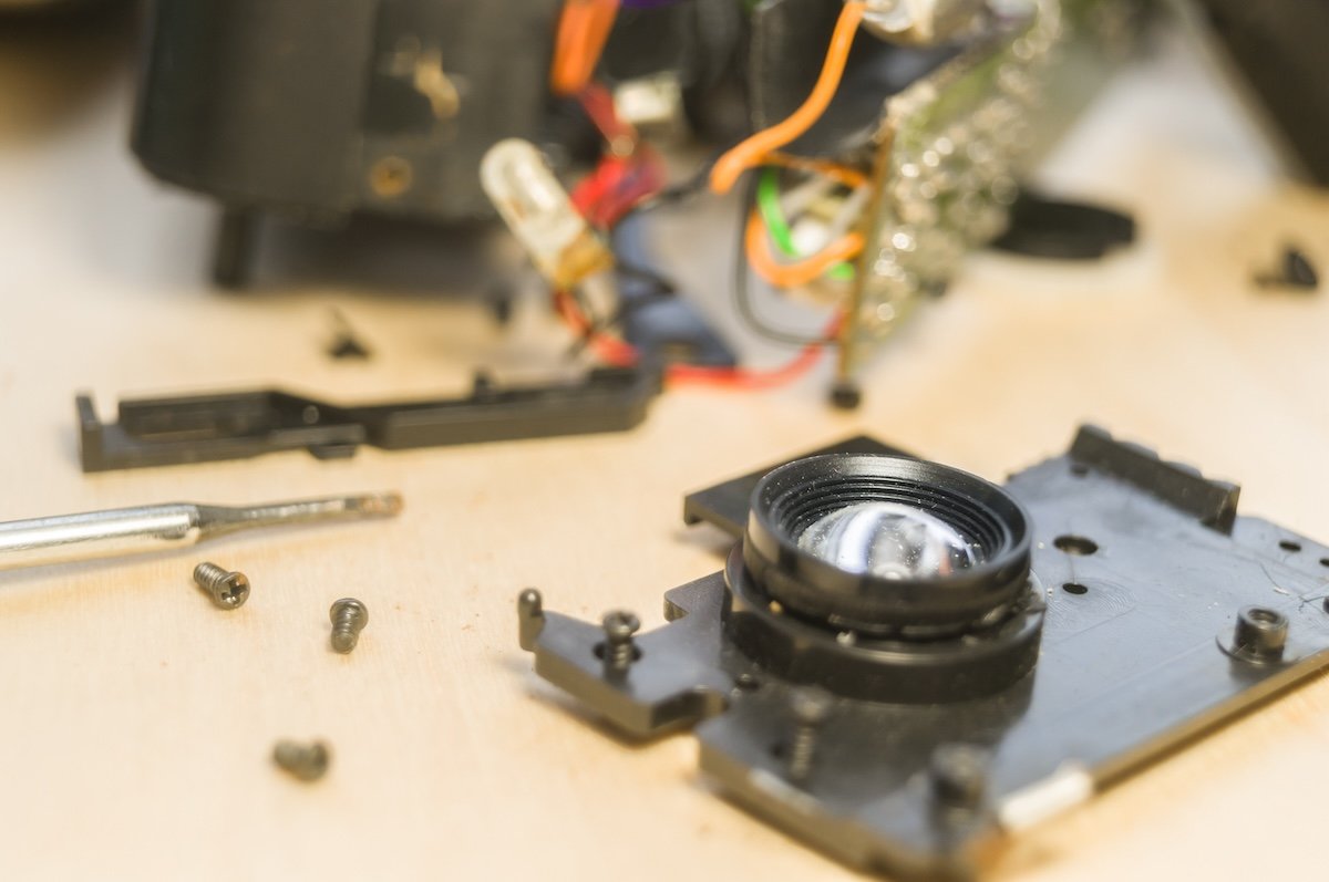 A point-and-shoot camera taken apart for a DIY macro lens
