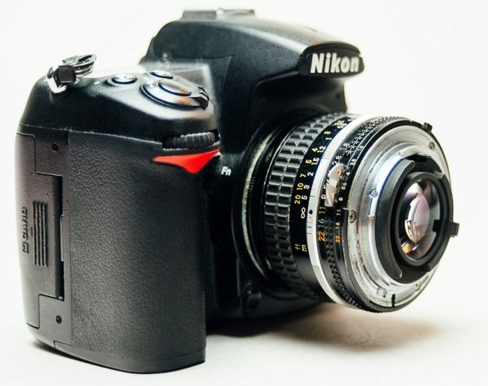 DSLR camera fitted with lens reversing rings