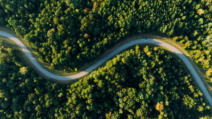 A curving road shot from a flat lay angle