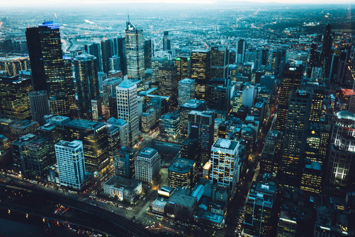 A cityscape shot at blue hour with a drone