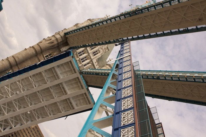 A bridge with the underside of it in the foreground.