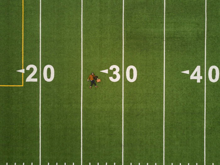 A flat lay image of a football field photographed with a drone