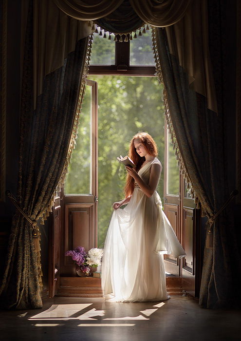 Fairy image of a model behind curtains