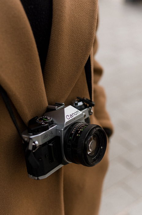 Vintage Canon SLR film hanging on a shoulder strap