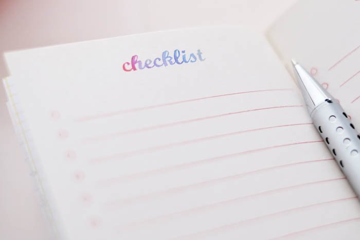 Image of a notebook with checklist written