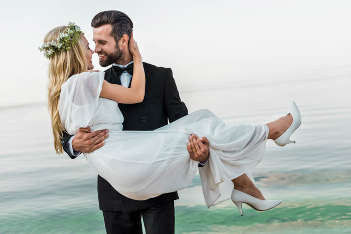 Real Wedding couple pose on porch