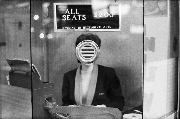 Woman at the cashier by Joel Meyerowitz