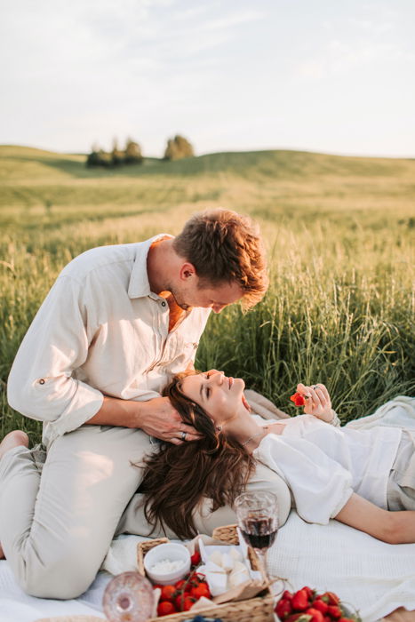 A couple doing a romantic picnic on Valentine's day.