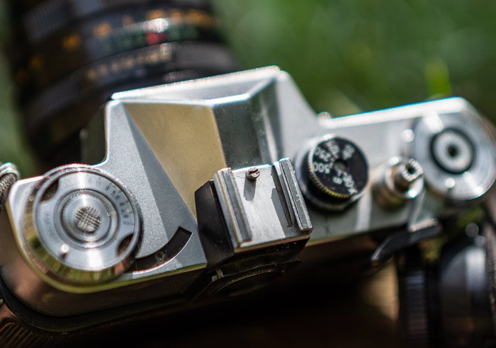 overhead shot of an analog camera with cold shoe mount