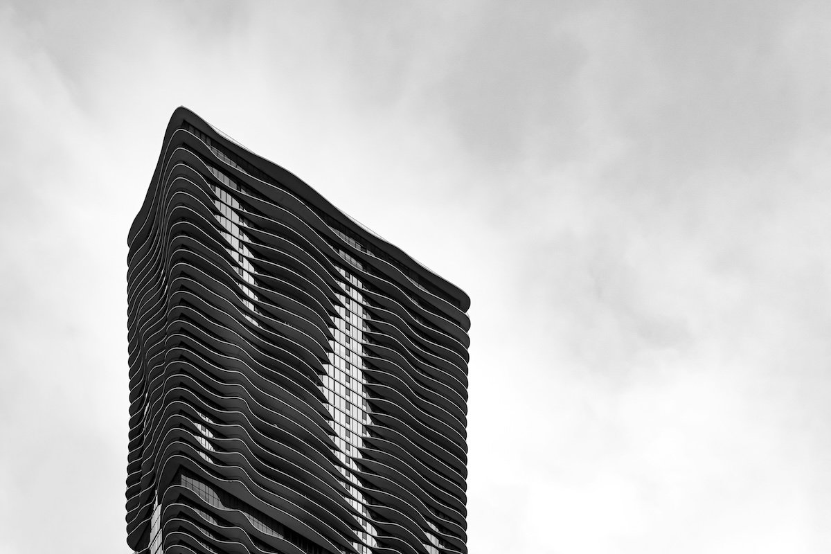 Black-and-white building with empty sky around it for asymmetrical visual weight