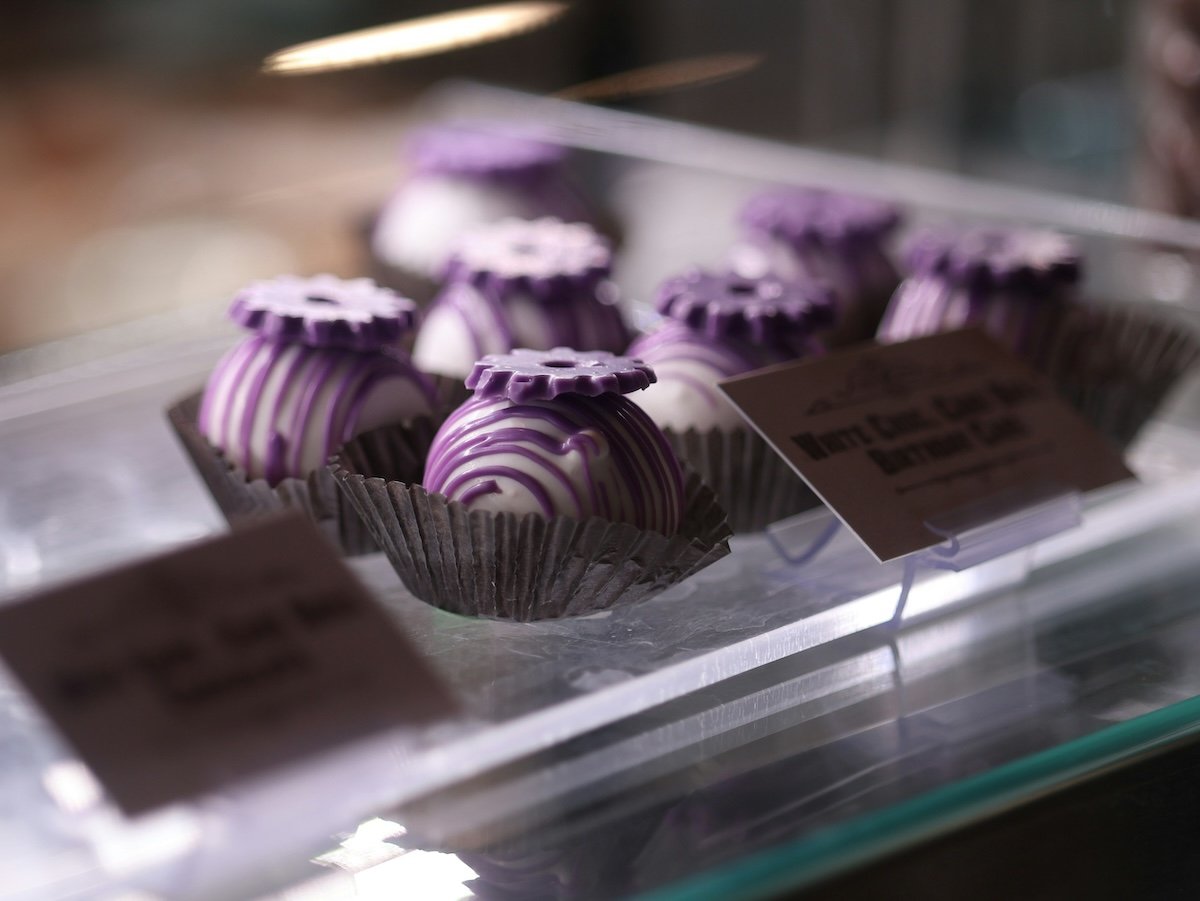 Sweets on display in a case with selective focus showing visual weight